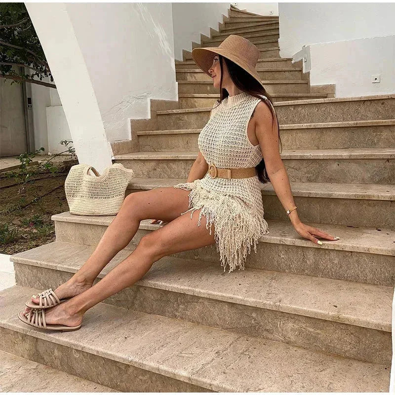 Women’s ivory sleeveless mini dress featuring tassel accents, crafted from soft cotton for comfort and casual style.