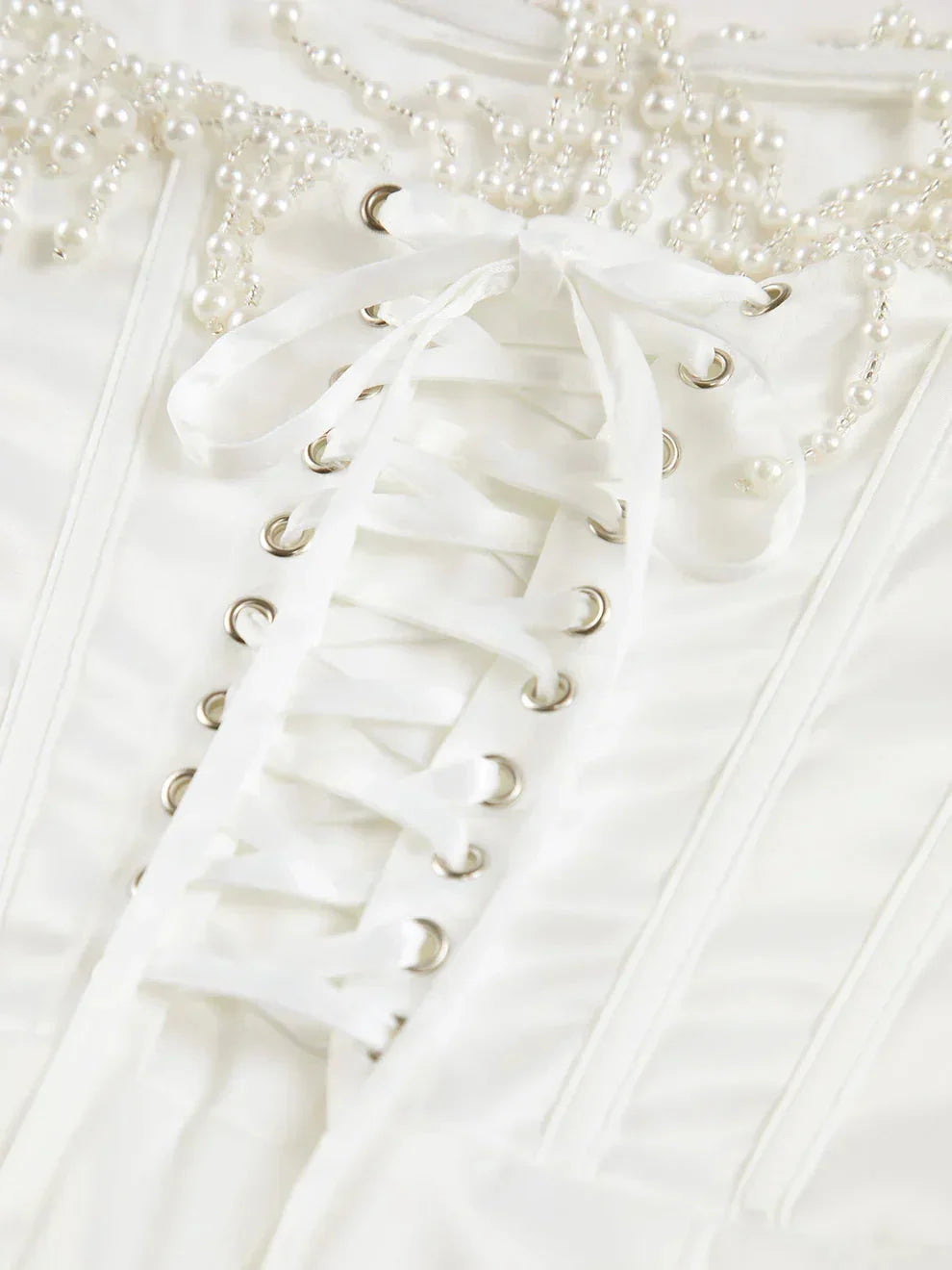 Ivory strapless beaded corset midi dress, featuring intricate beadwork and a fitted silhouette for a stylish look.