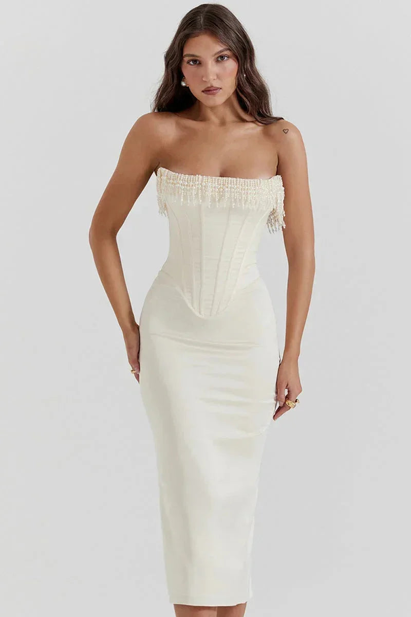 Ivory strapless midi dress with a beaded corset, crafted from soft fabric, perfect for formal occasions.