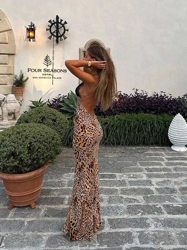 Women’s leopard print maxi dress featuring a lace plunging neckline, crafted from lightweight, breathable fabric for comfort.