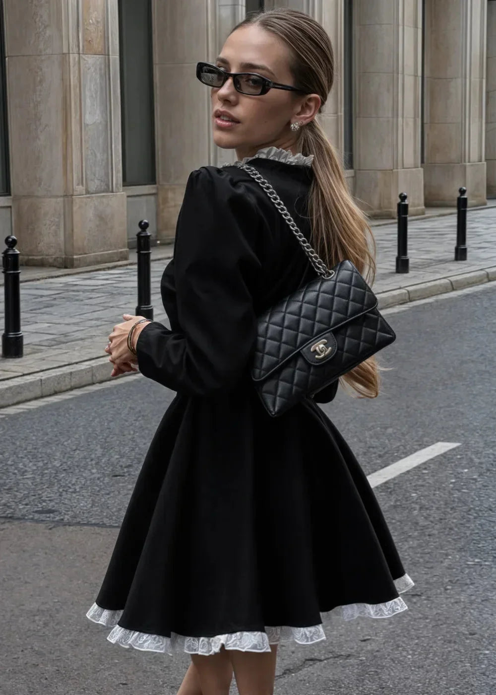 Women's long-sleeve mini dress in soft fabric, featuring a ruffle hem and round collar for a playful look.