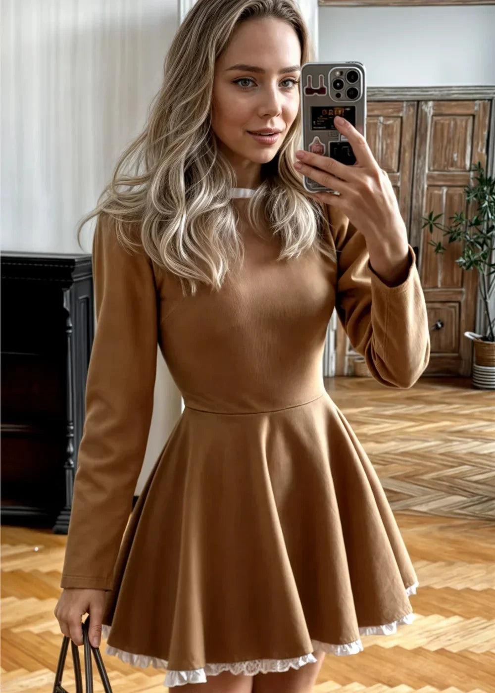 Brown women's long-sleeve mini dress with ruffle hem, round collar, made from soft fabric for comfort and style.