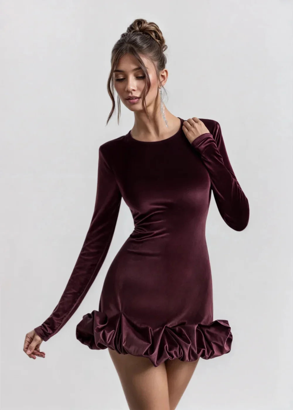 Women’s long-sleeve mini dress in soft velvet with a ruffle hem, perfect for casual outings or evening events.