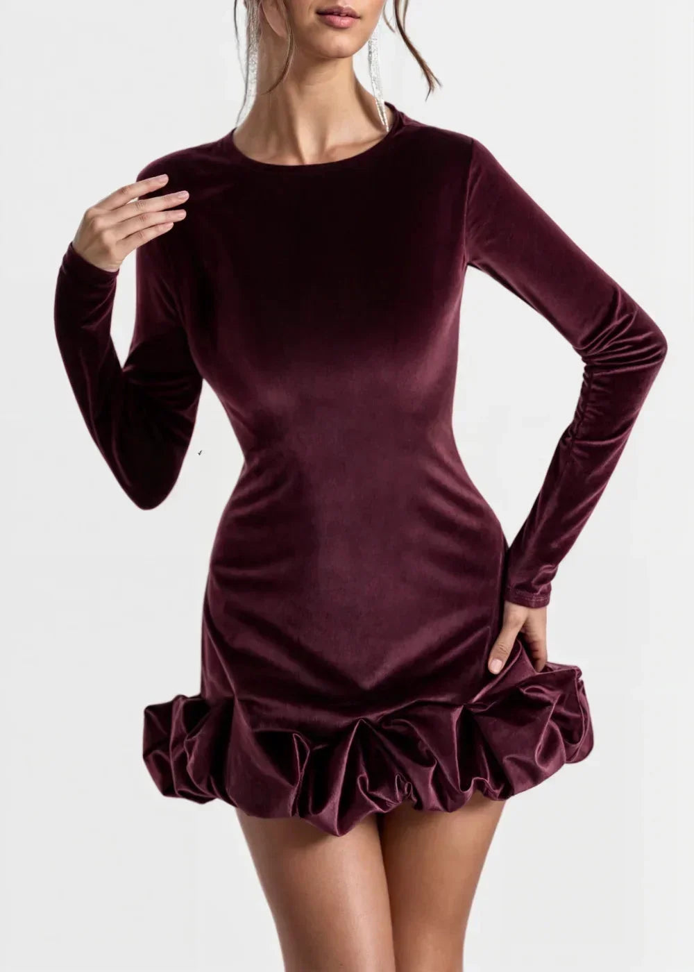 Women’s long-sleeve velvet mini dress with ruffle hem, featuring soft fabric and a comfortable fit for versatile styling.