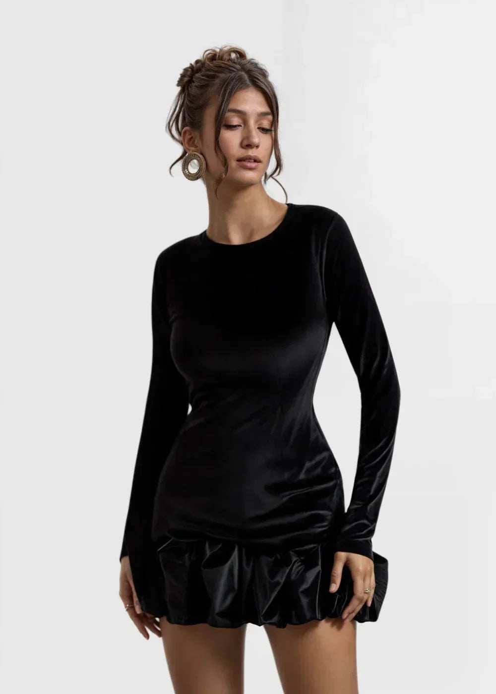 Women’s long-sleeve velvet mini dress featuring a ruffle hem and soft, textured fabric for a stylish look.
