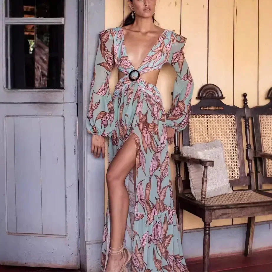 Women’s long-sleeved deep-v floral maxi dress made of lightweight fabric, featuring a side slit for ease of movement.
