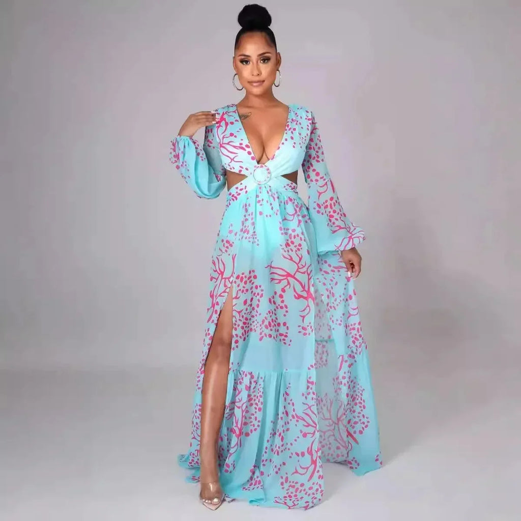 Women’s blue long-sleeved floral maxi dress with deep V-neck and side slit, made from lightweight, breathable fabric.