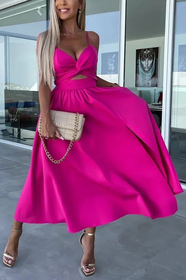 Women’s midi dress featuring a cut-out waist, practical side pockets, and crafted from soft, breathable fabric.