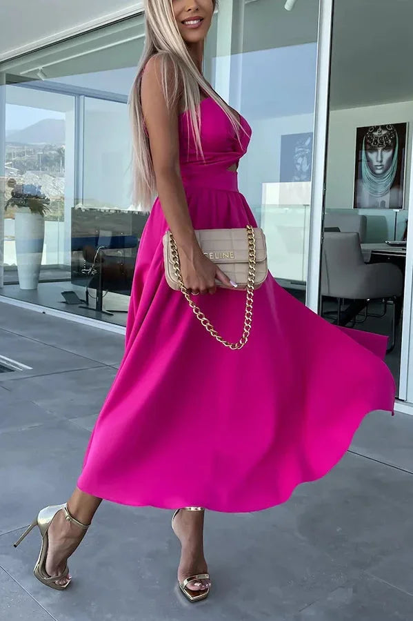 Women’s midi dress featuring a cut-out waist, side pockets, and made from lightweight, breathable fabric for comfort.