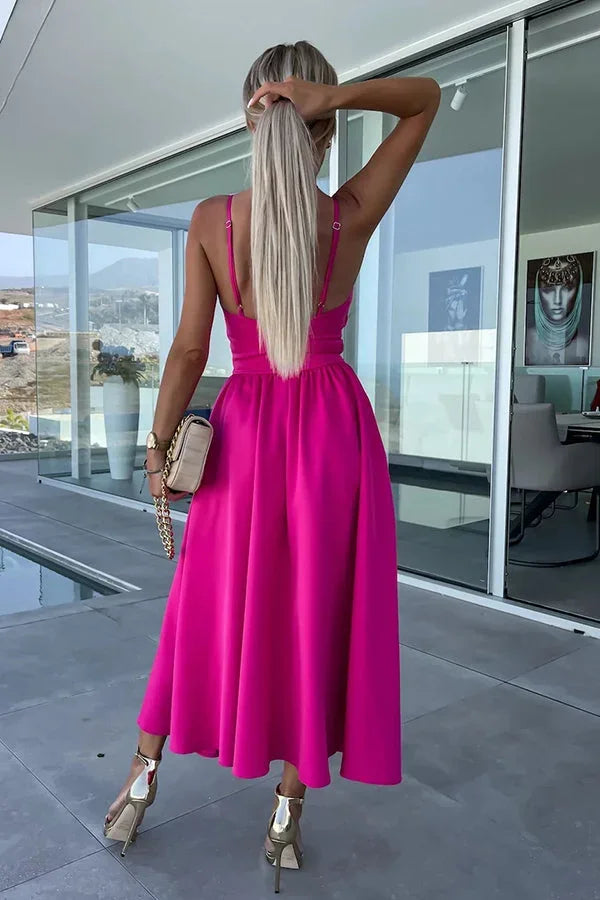 Women's midi dress featuring a cut-out waist and pockets, made from breathable cotton blend for comfort and style.