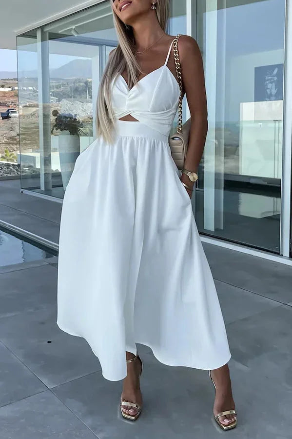 Women’s midi dress in breathable fabric featuring a cut-out waist and practical pockets for everyday wear.