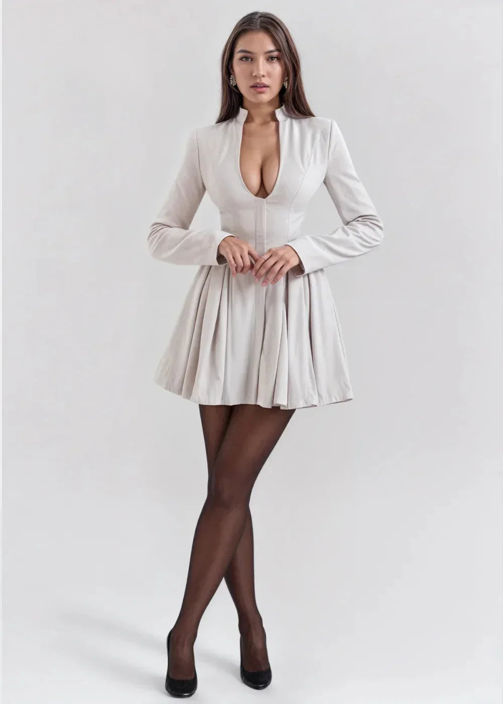 Women’s mini dress featuring a pleated skirt, deep neckline, and lightweight fabric, perfect for casual outings or summer…