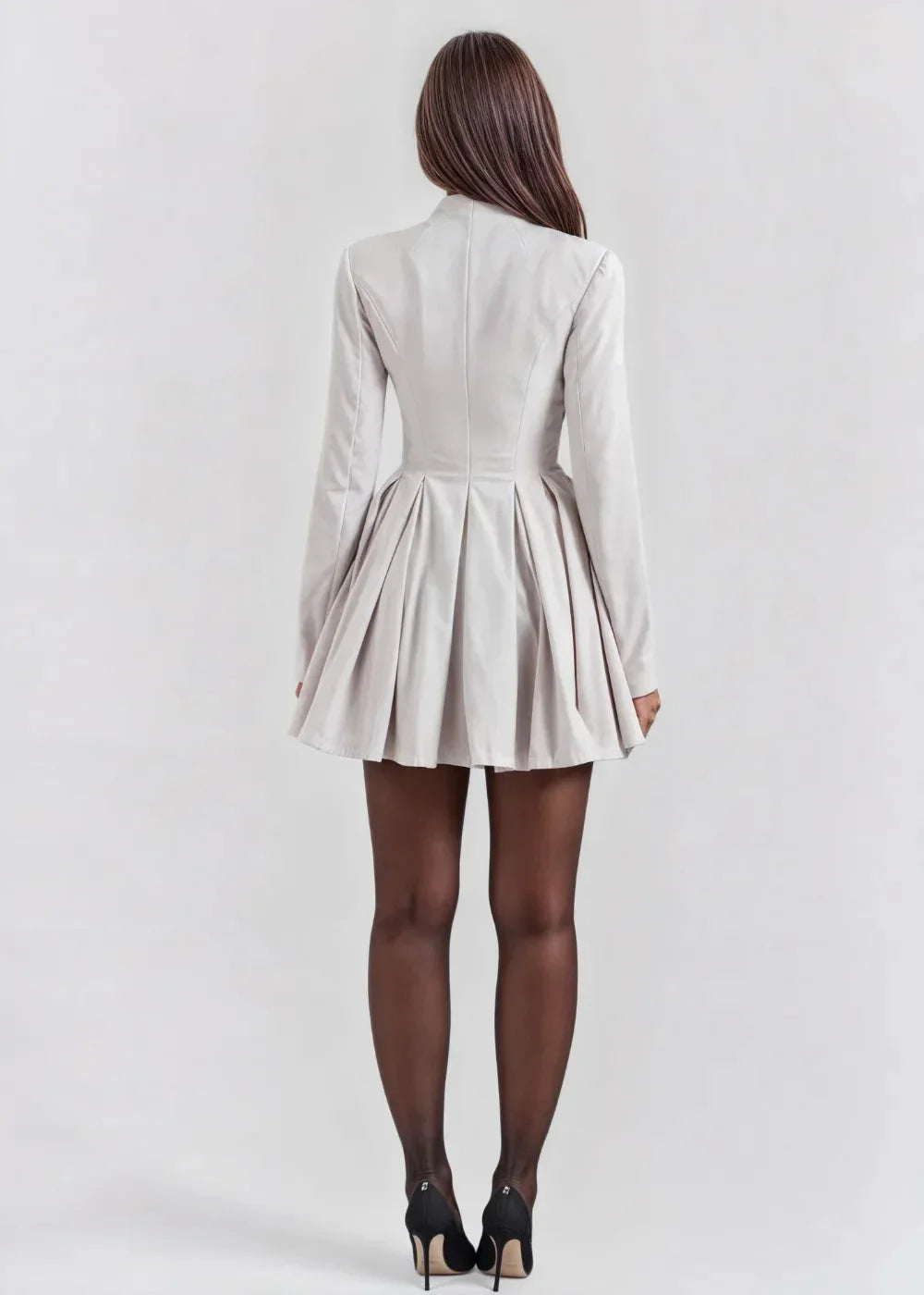 Women's mini dress featuring a pleated skirt, deep neckline, and soft fabric for comfort and casual elegance.