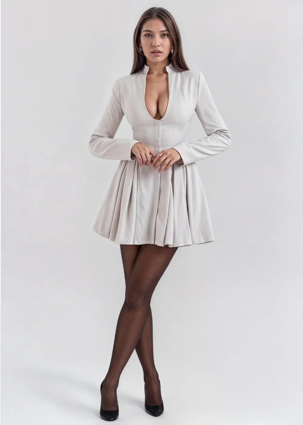 Grey women's mini dress featuring a pleated skirt and a deep neckline, crafted from soft, breathable fabric for comfort.
