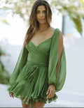 Pistachio off-shoulder mini dress with ruffle detail, made from lightweight fabric for a breezy, comfortable fit.