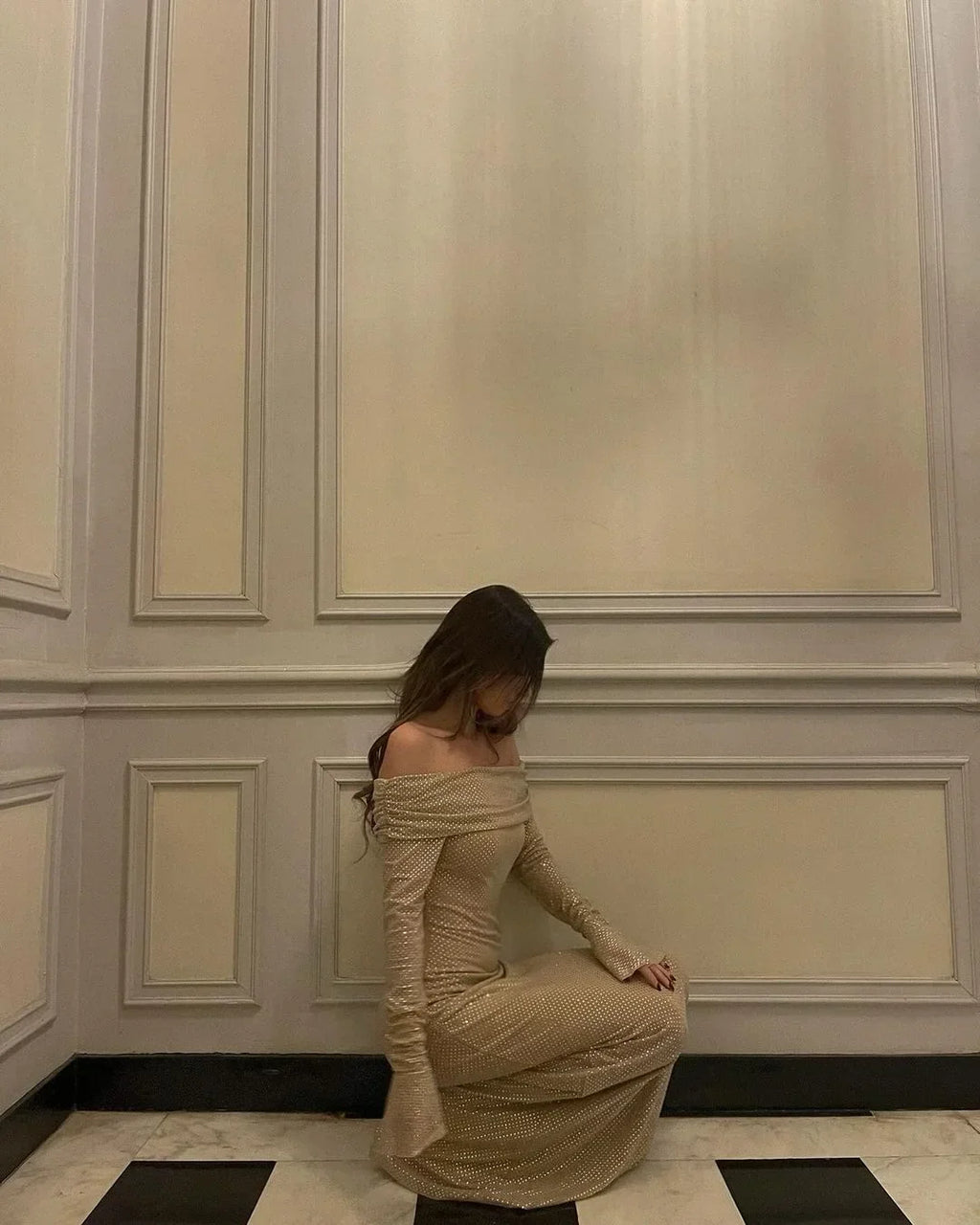 Women’s off-shoulder maxi dress featuring glitter fabric and flare sleeves, perfect for special occasions and evening wear.