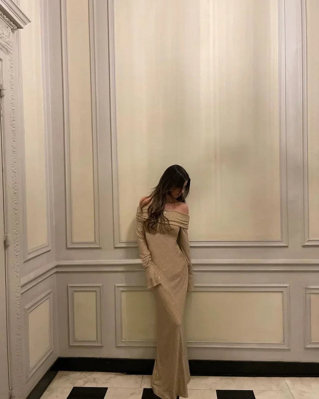 Women’s off-shoulder glitter maxi dress featuring flare sleeves and a flowing silhouette, made from lightweight, sparkling…