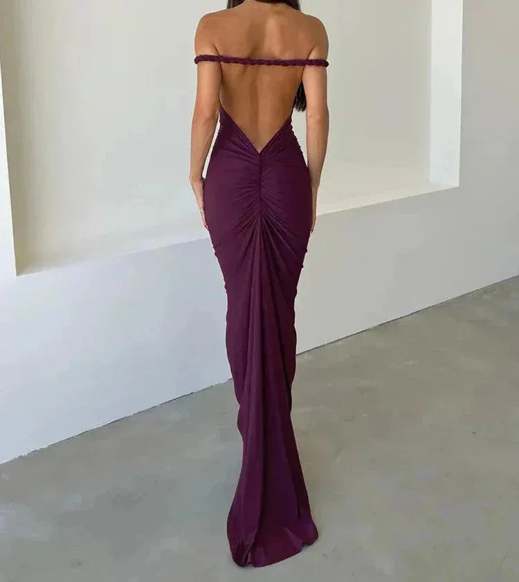 Purple off-shoulder maxi dress with ruched detailing and a fitted backless design, made from soft, breathable fabric.