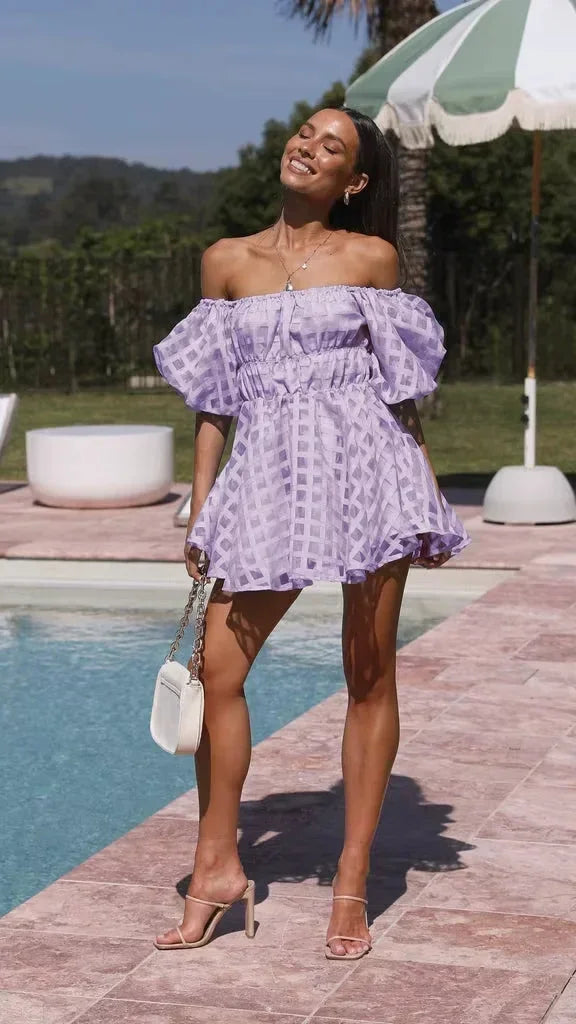 Purple off-shoulder mini dress with textured fabric and puff sleeves, perfect for casual outings or summer events.