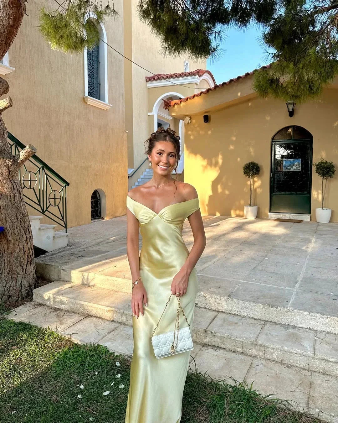 Women’s off-shoulder yellow maxi dress with a flowy silhouette, crafted from lightweight fabric, paired with a matching…