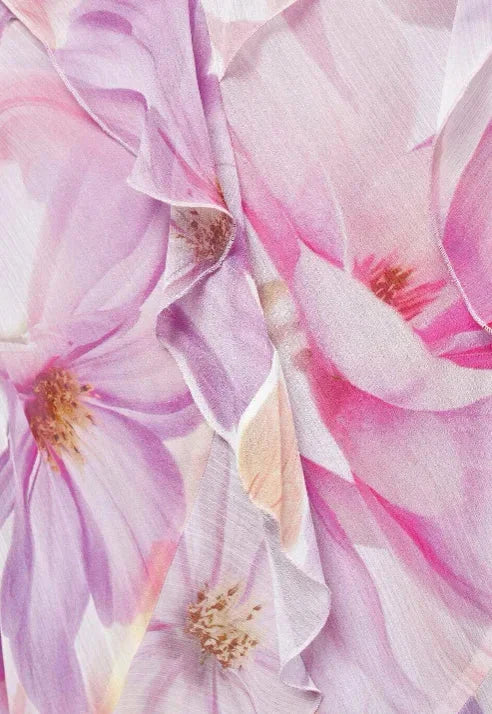 Women’s pink floral asymmetric midi dress featuring ruffles, made of lightweight fabric perfect for spring and summer…