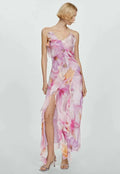 Women’s pink floral asymmetric midi dress featuring ruffles, made of lightweight fabric, perfect for warm weather outings.