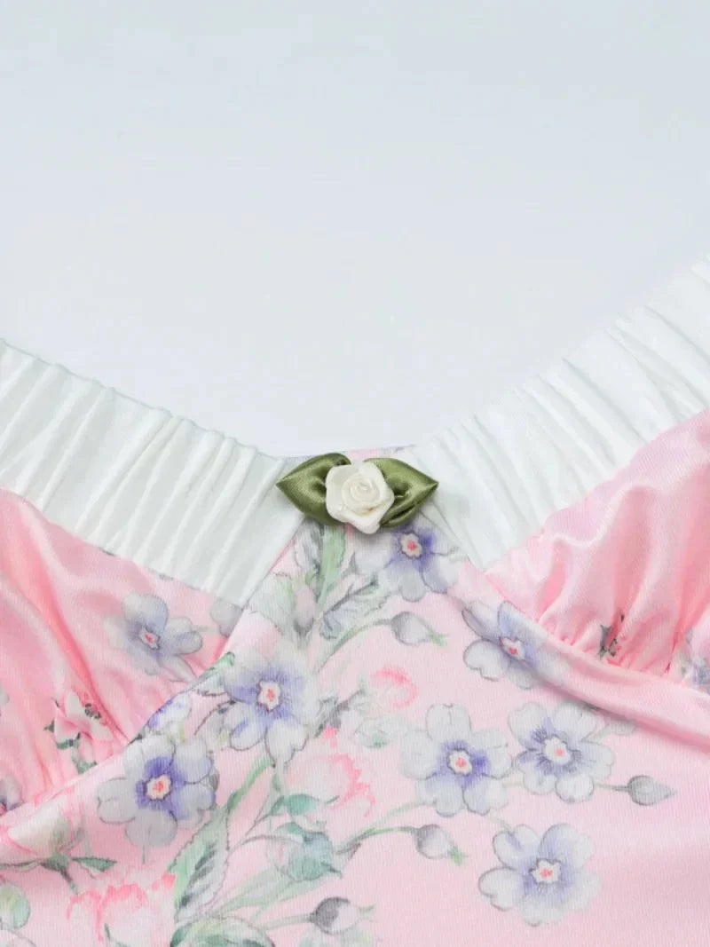 Women’s pink floral maxi dress with sweetheart neckline, crafted from lightweight fabric, featuring a flowy silhouette and…