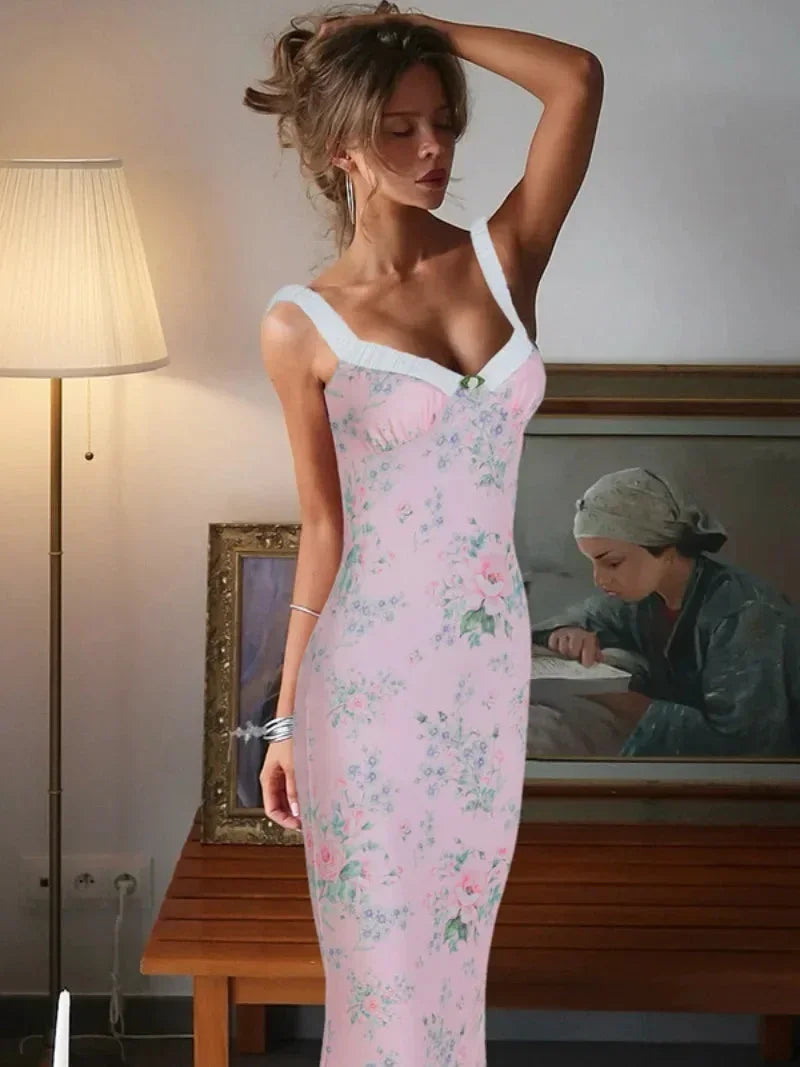 Women’s pink floral maxi dress featuring a sweetheart neckline and lightweight fabric, perfect for summer outings.