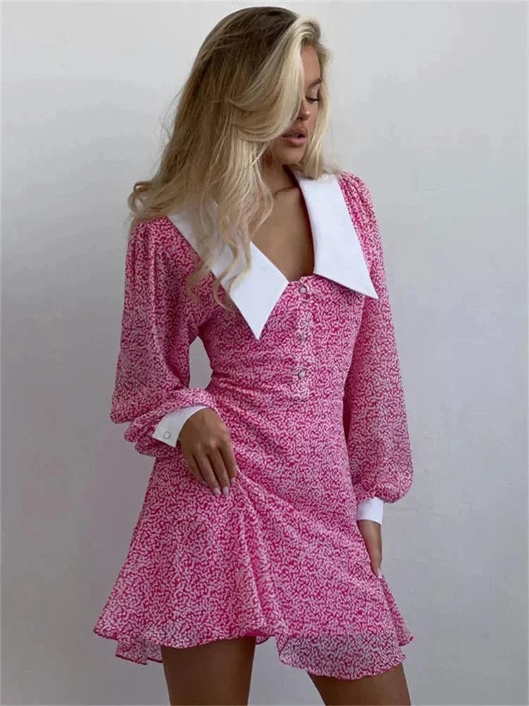 Women's pink floral mini dress with puff sleeves and a white collar, made from lightweight cotton for comfort and style.