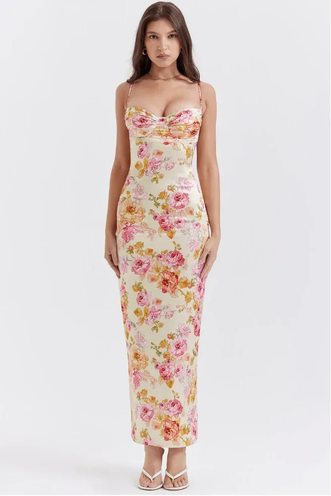 Women’s pink floral satin maxi dress featuring delicate straps and a flowing silhouette, perfect for warm weather occasions.
