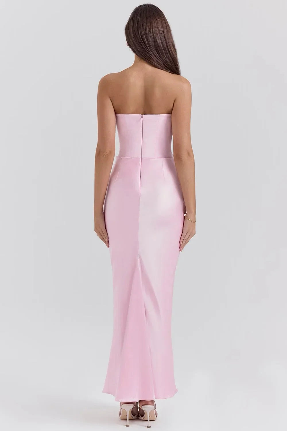 Women’s pink strapless satin maxi dress featuring ruched detail for a flattering silhouette and elegant flow.