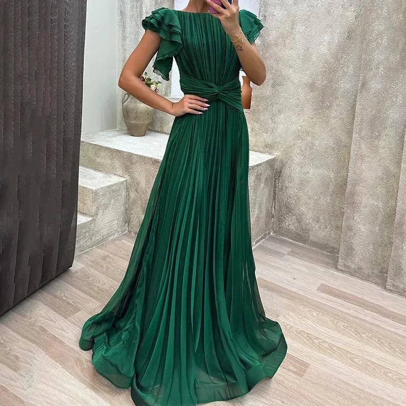 Green pleated maxi dress for women, featuring ruffled sleeves and a stylish tie detail, crafted from lightweight fabric.