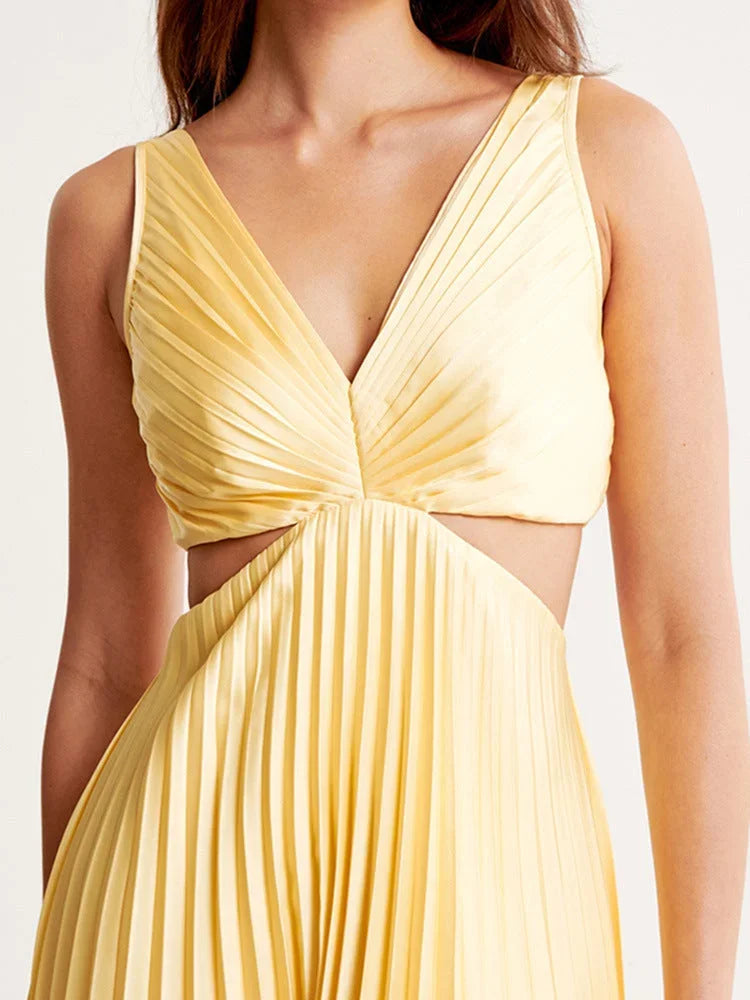 Women’s yellow maxi dress with pleats, cut-out detail, plunging neckline, made from soft, breathable fabric for comfort.