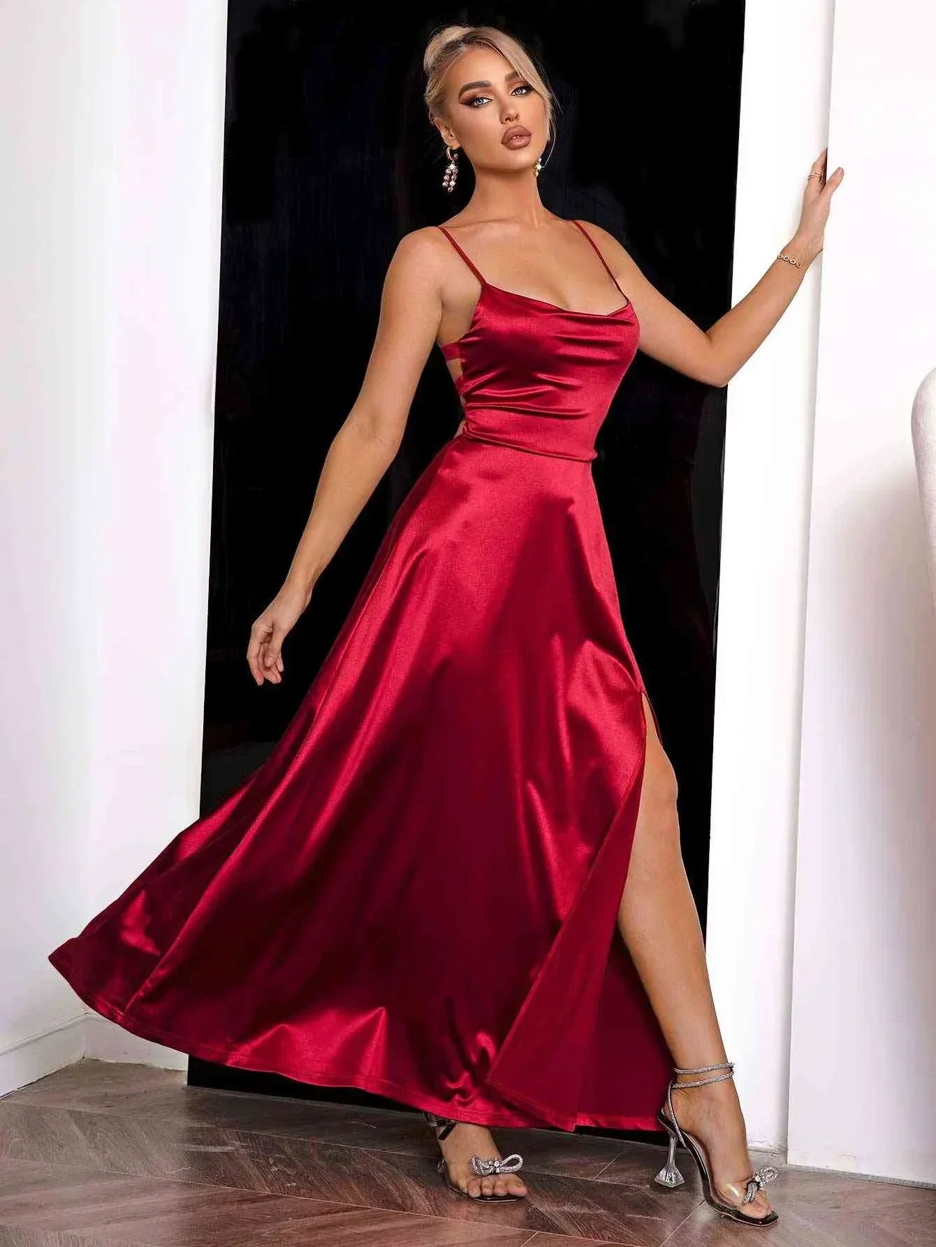 Red satin maxi dress for women featuring spaghetti straps and a flowy design, perfect for formal or casual occasions.