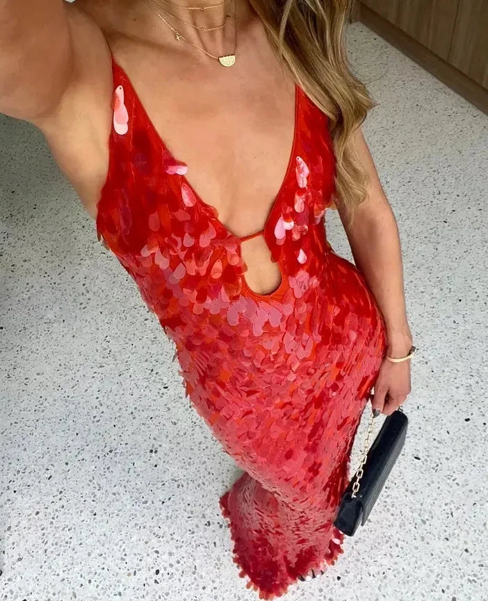 Women's red sequin maxi dress featuring a deep V-neck, crafted from soft fabric that glimmers under light. Perfect for…