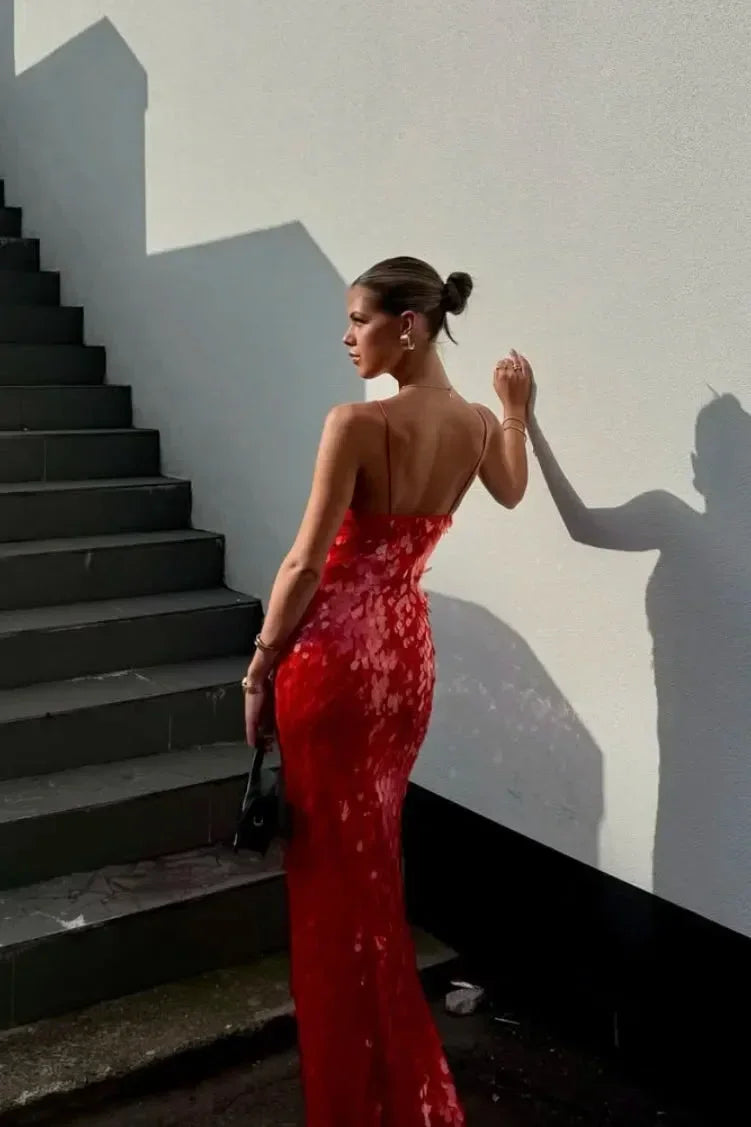 Women’s red sequin maxi dress featuring a deep V-neck, crafted from breathable fabric with sparkling embellishments.