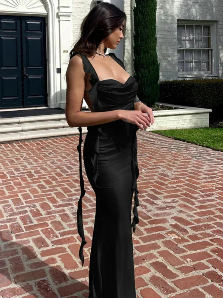 Women’s satin cowl neck dress featuring side ties and an open back, designed for a flattering fit and elegant drape.