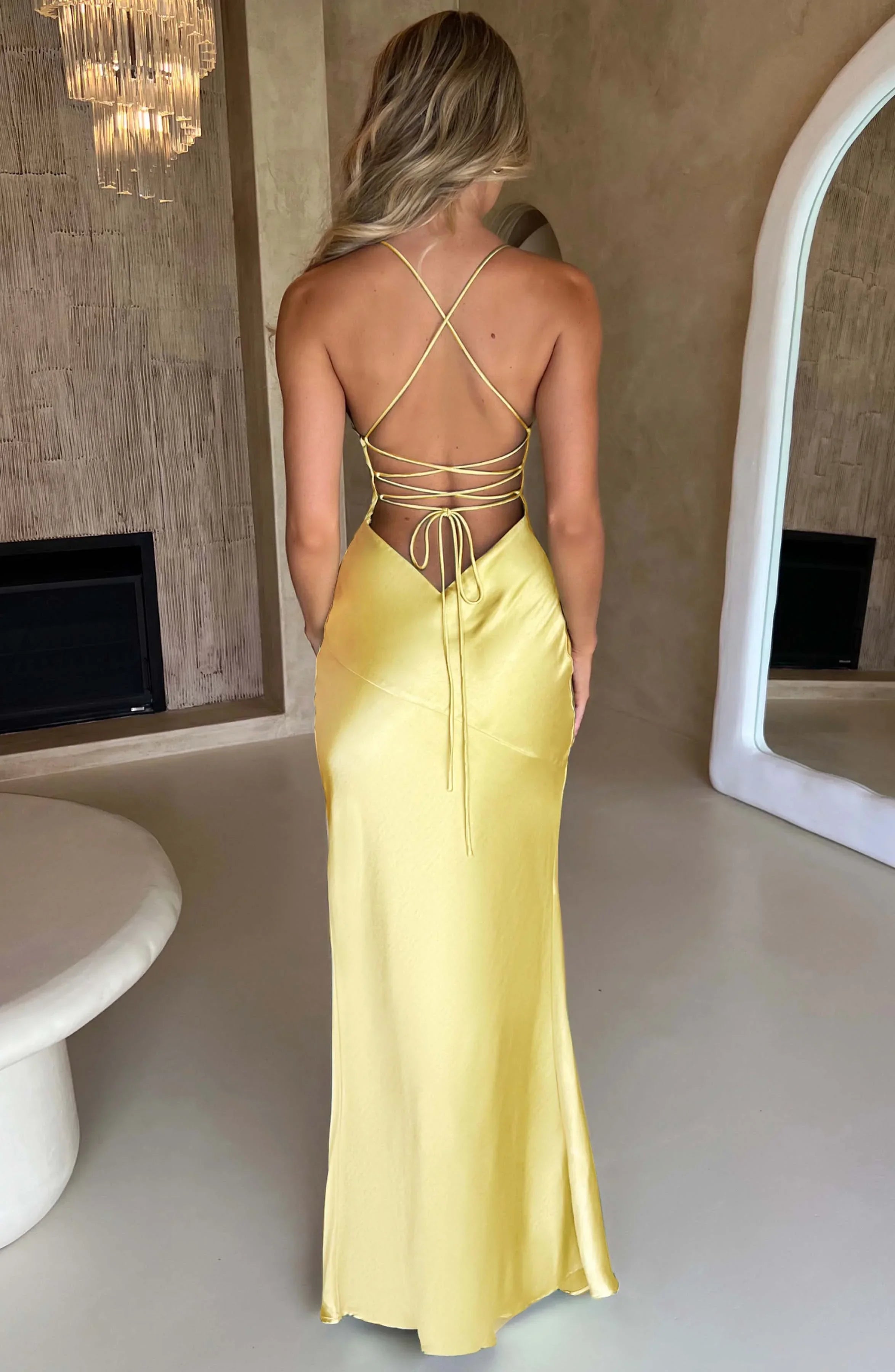Women’s satin maxi dress featuring a V-neckline and a thigh-high slit, ideal for stylish summer outings or evening events.