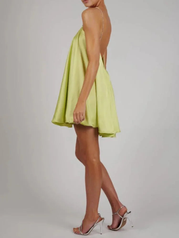 Women’s satin mini dress featuring chain detailing, designed for a sleek look with a comfortable fit.