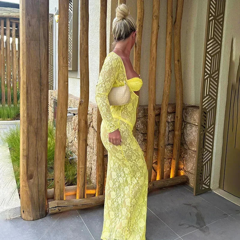 Yellow women’s sheer lace maxi dress featuring front cutouts and delicate floral patterns, perfect for summer occasions.