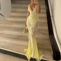 Women’s sheer yellow backless maxi dress with sequins, featuring a flowy design and delicate embellishments for a stylish…