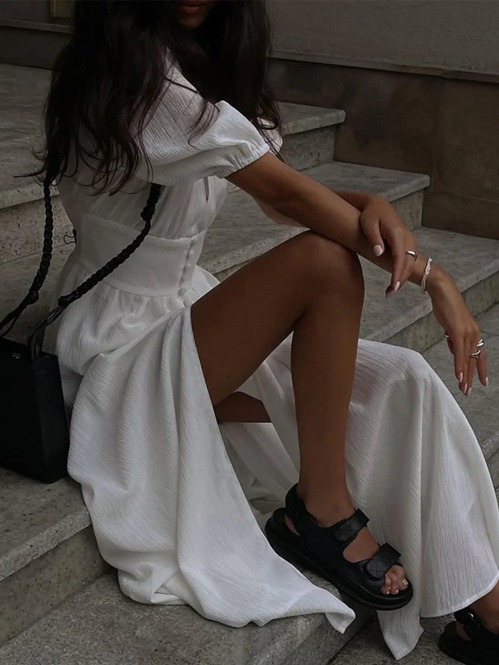 Women's shirt maxi dress in breathable cotton, featuring a fitted waist and stylish puff sleeves for a comfortable fit.