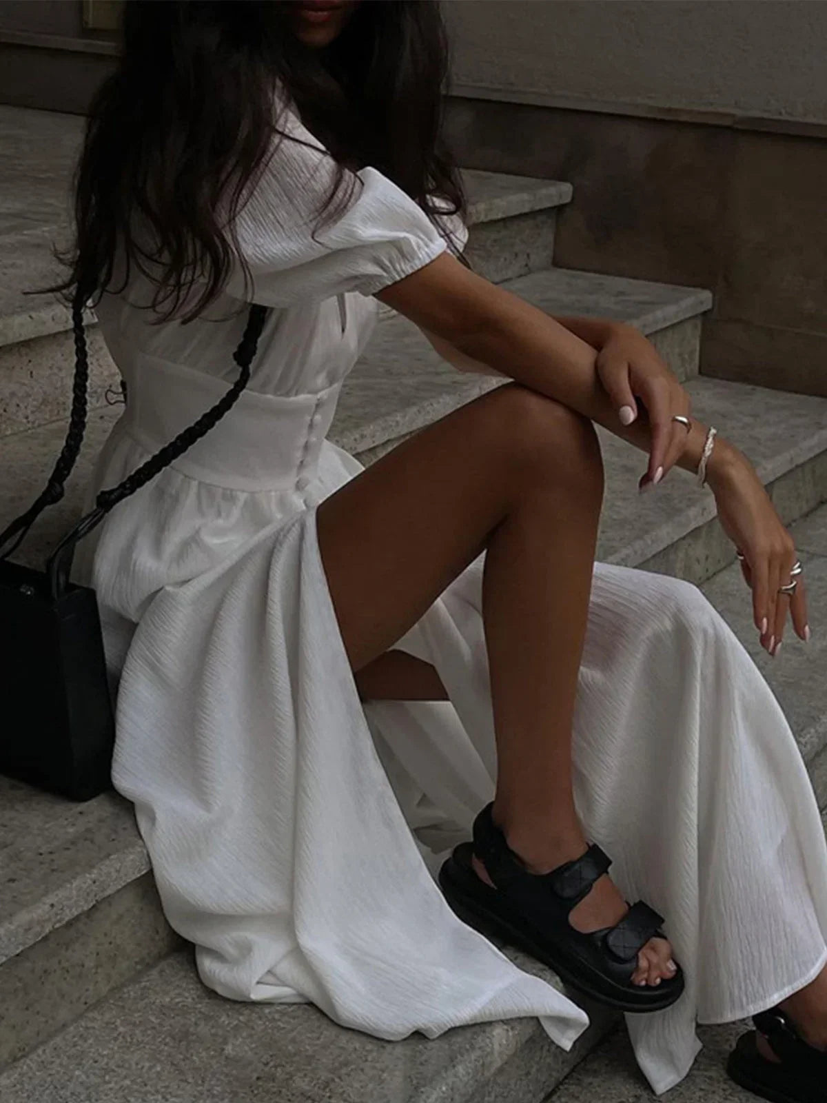 Women's shirt maxi dress in breathable cotton, featuring a fitted waist and stylish puff sleeves for a comfortable fit.