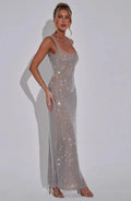 Women’s silver mesh sleeveless shimmer maxi dress made of lightweight material with a flowing silhouette and shimmering…