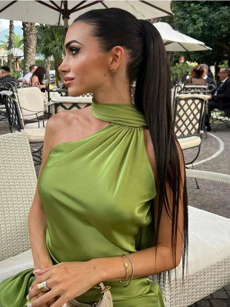 Women’s satin floor-length cape dress featuring a halter neck design, smooth fabric, and elegant drape for fluid movement.