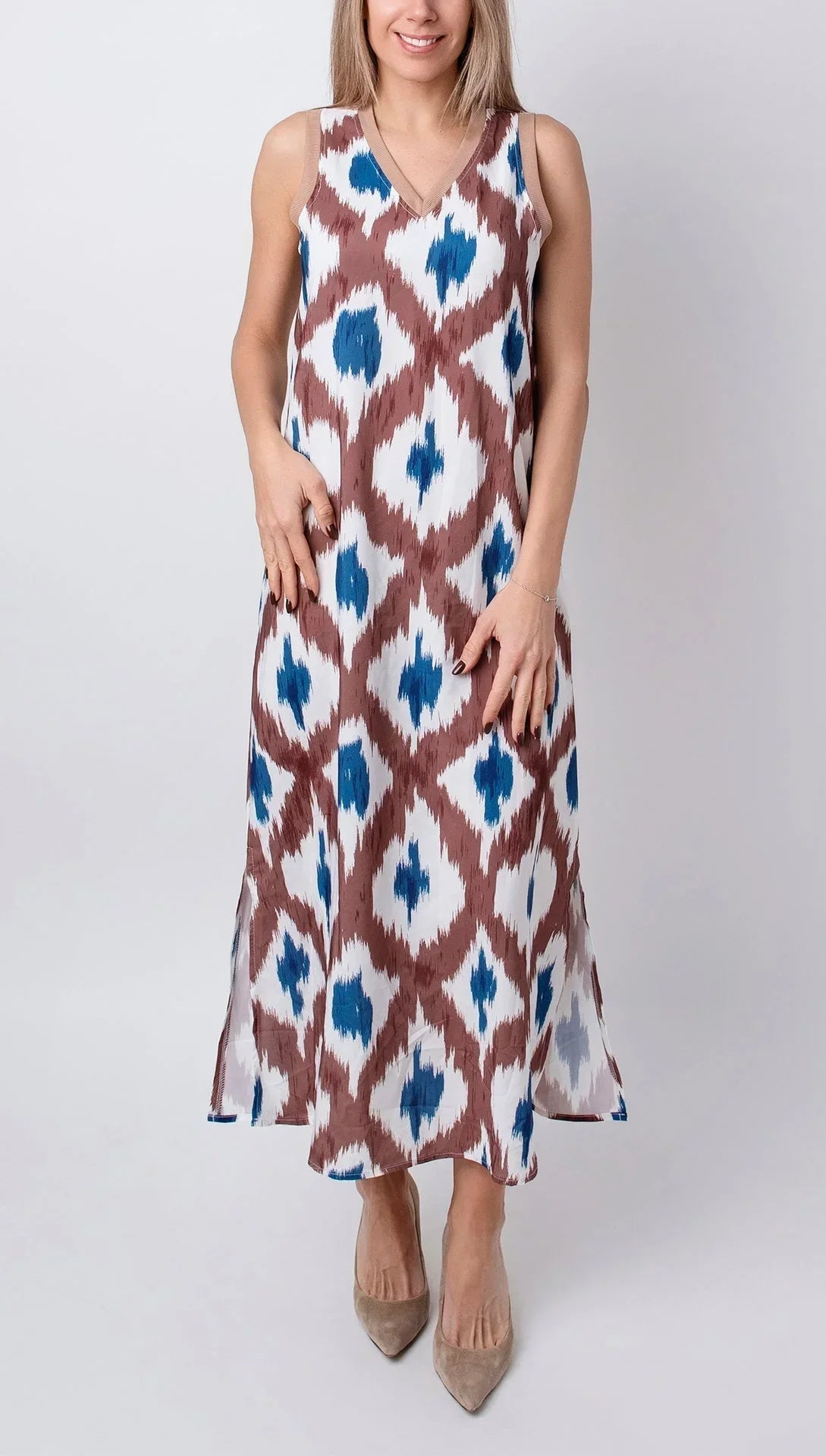 Women’s sleeveless midi dress featuring a brown and blue print, v-neck design, crafted from lightweight and breathable…