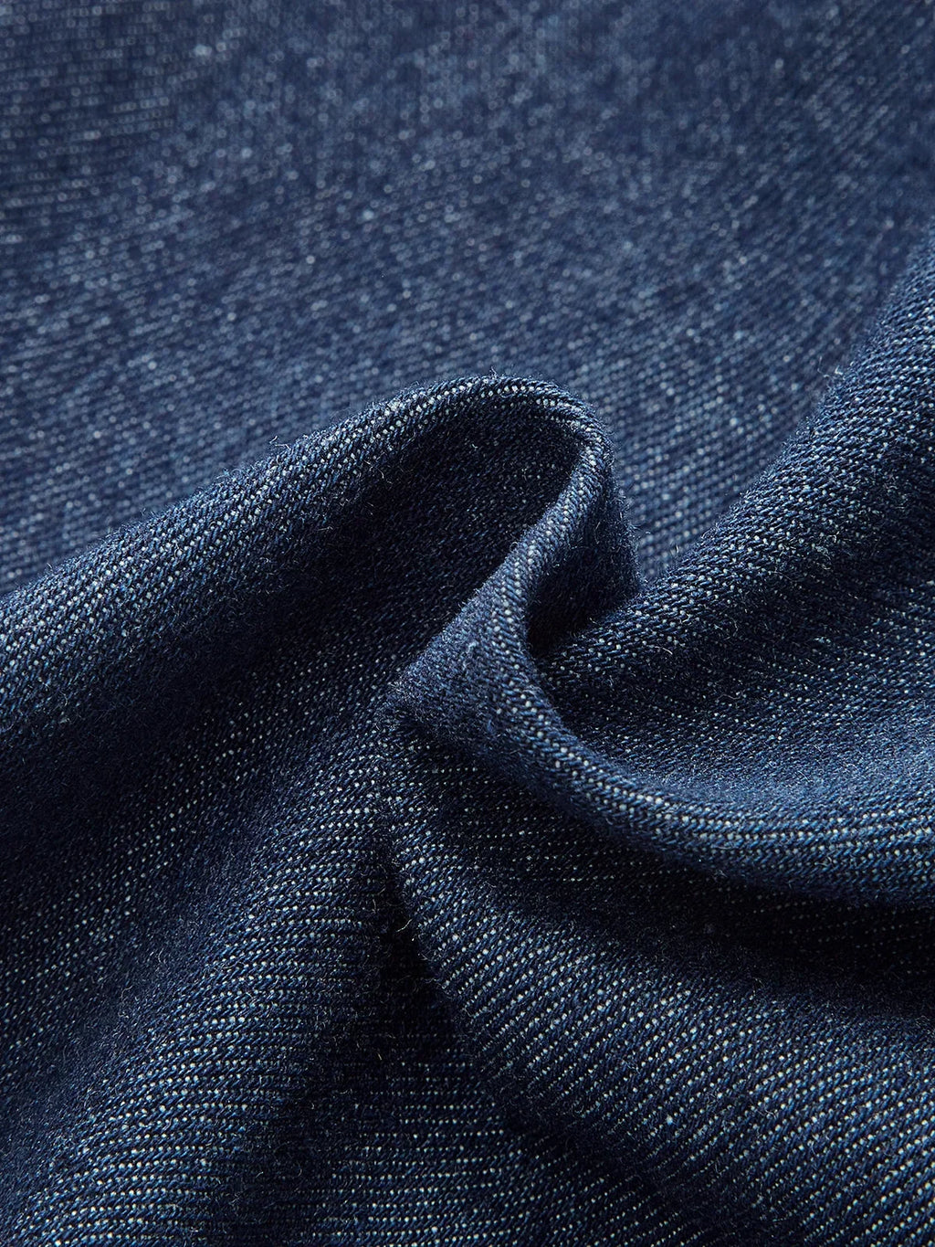 Women's sleeveless dark blue denim midi dress with button-down front and classic collar, perfect for casual outings.