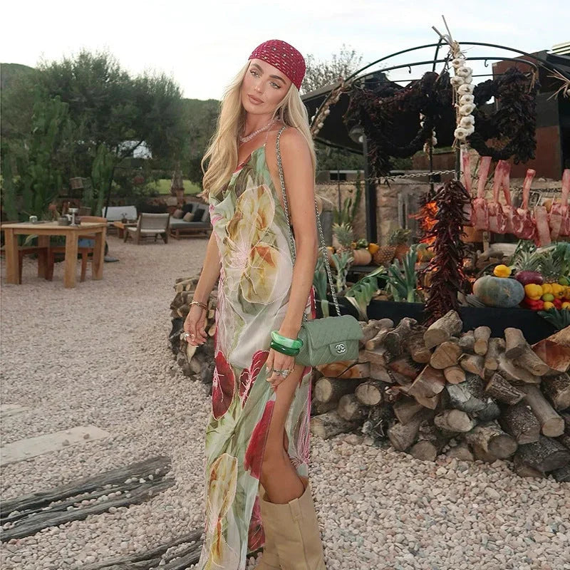 Women's sleeveless floral maxi dress featuring a side slit, crafted from lightweight fabric for comfortable wear and flowy…