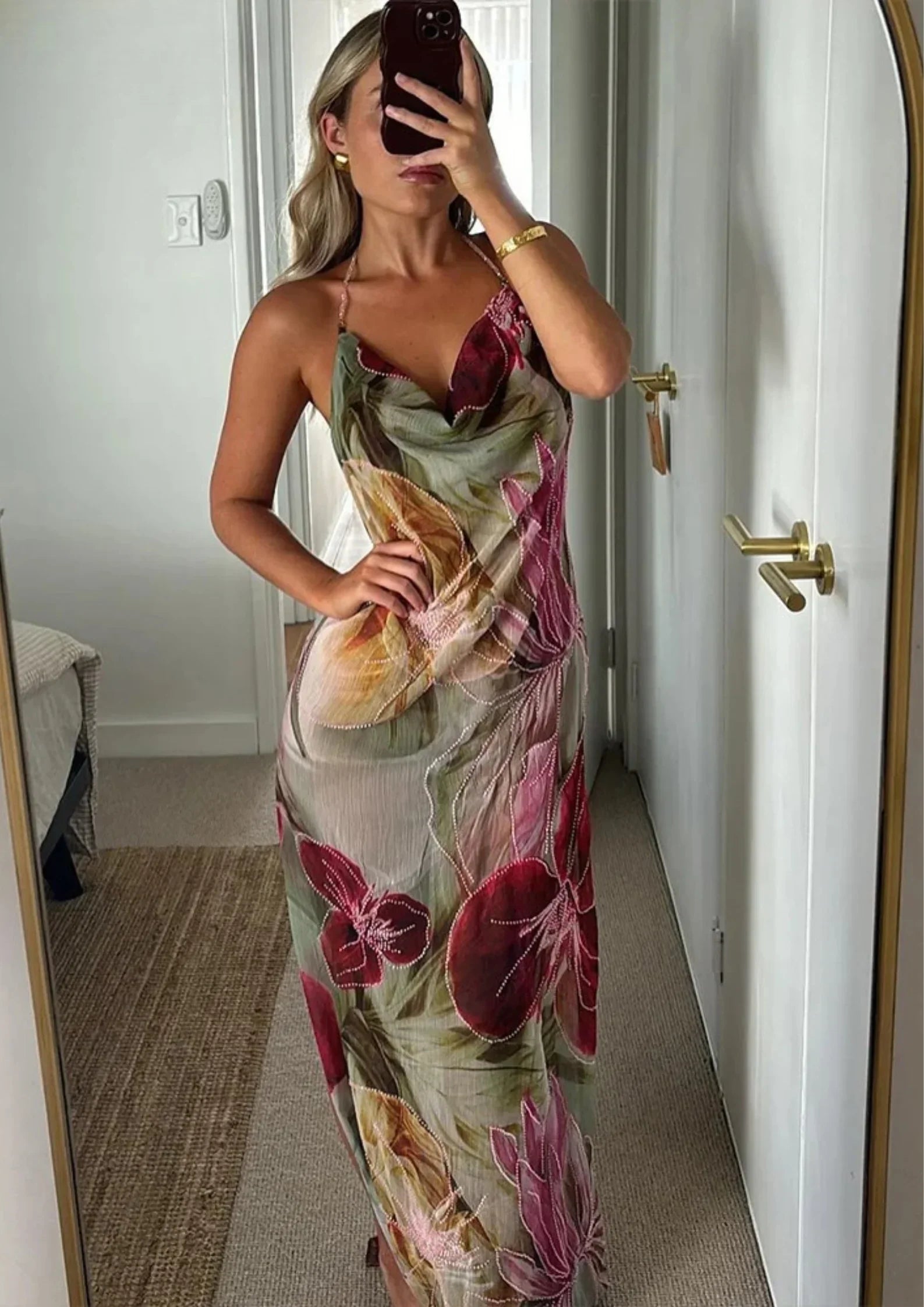 Sleeveless floral maxi dress for women featuring a side slit and lightweight fabric, perfect for warm weather outings.