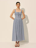 Women’s sleeveless navy gingham midi dress featuring a square neckline and lightweight fabric for comfort and style.